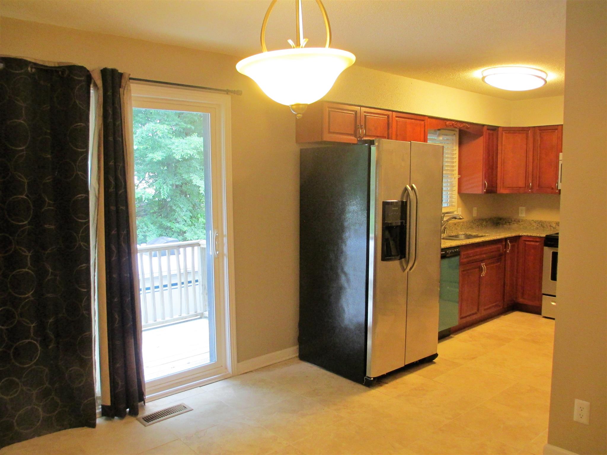 3208 Cedar Ridge Road Nashville, TN 37214 - Photo 8 of 18 Deck access from the kitchen/dining area