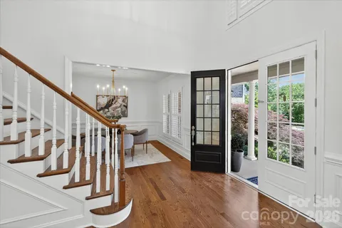 a view of entryway with wooden floor and stairs