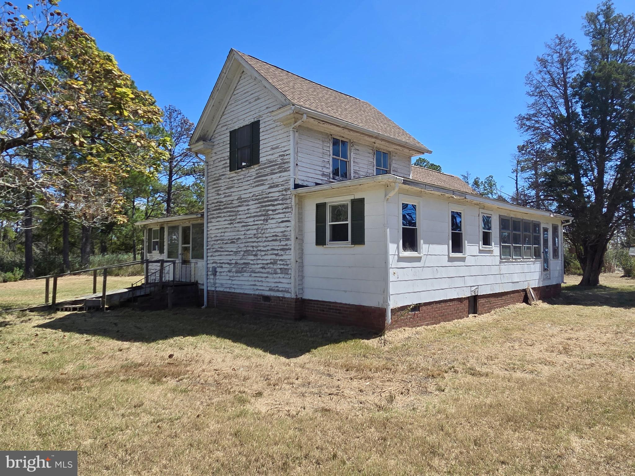Brady Todd Road Crocheron, MD 21627 - Photo 24 of 111 a front view of a house with a yard