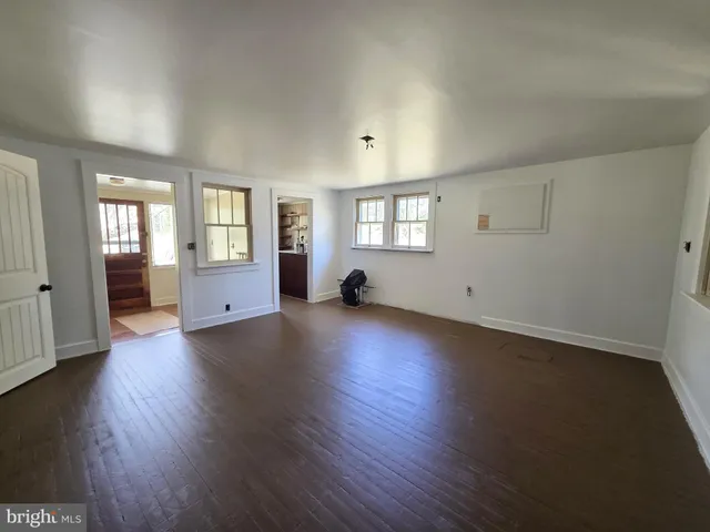 a backyard of a house with lots of green space and trees
