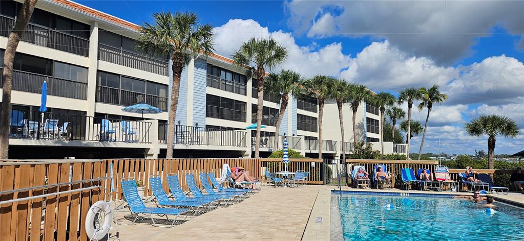 1501 Beach Road, Unit 403 Englewood, FL 34223 - Photo 3 of 8 a view of swimming pool with outdoor seating
