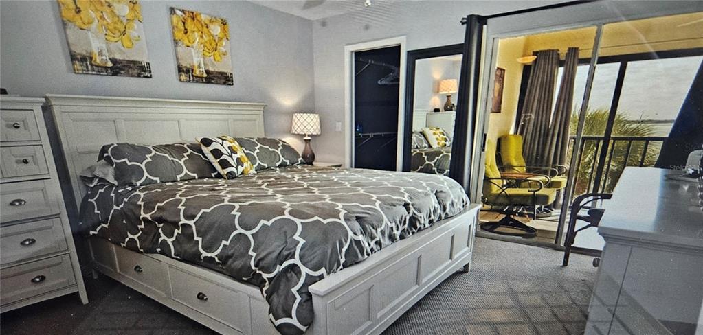 1501 Beach Road, Unit 403 Englewood, FL 34223 - Photo 7 of 8 a bed sitting in a bedroom next to a window