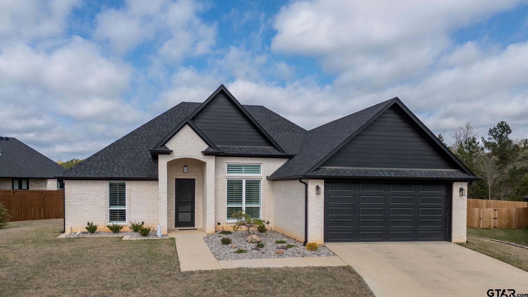 11858 Gillian Court Tyler, TX 75703 - Photo 1 of 24 a front view of a house with a yard
