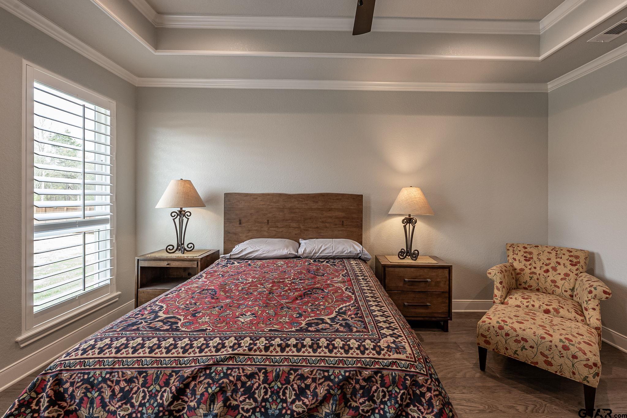 11858 Gillian Court Tyler, TX 75703 - Photo 11 of 24 a bedroom with a bed and a couch