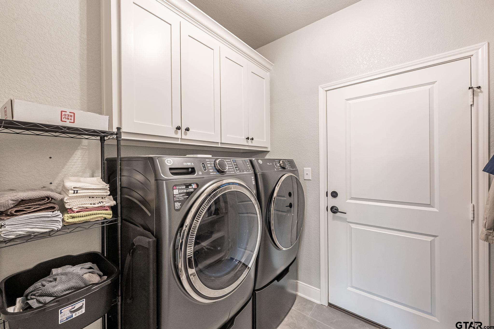 11858 Gillian Court Tyler, TX 75703 - Photo 17 of 24 a utility room with dryer and washer