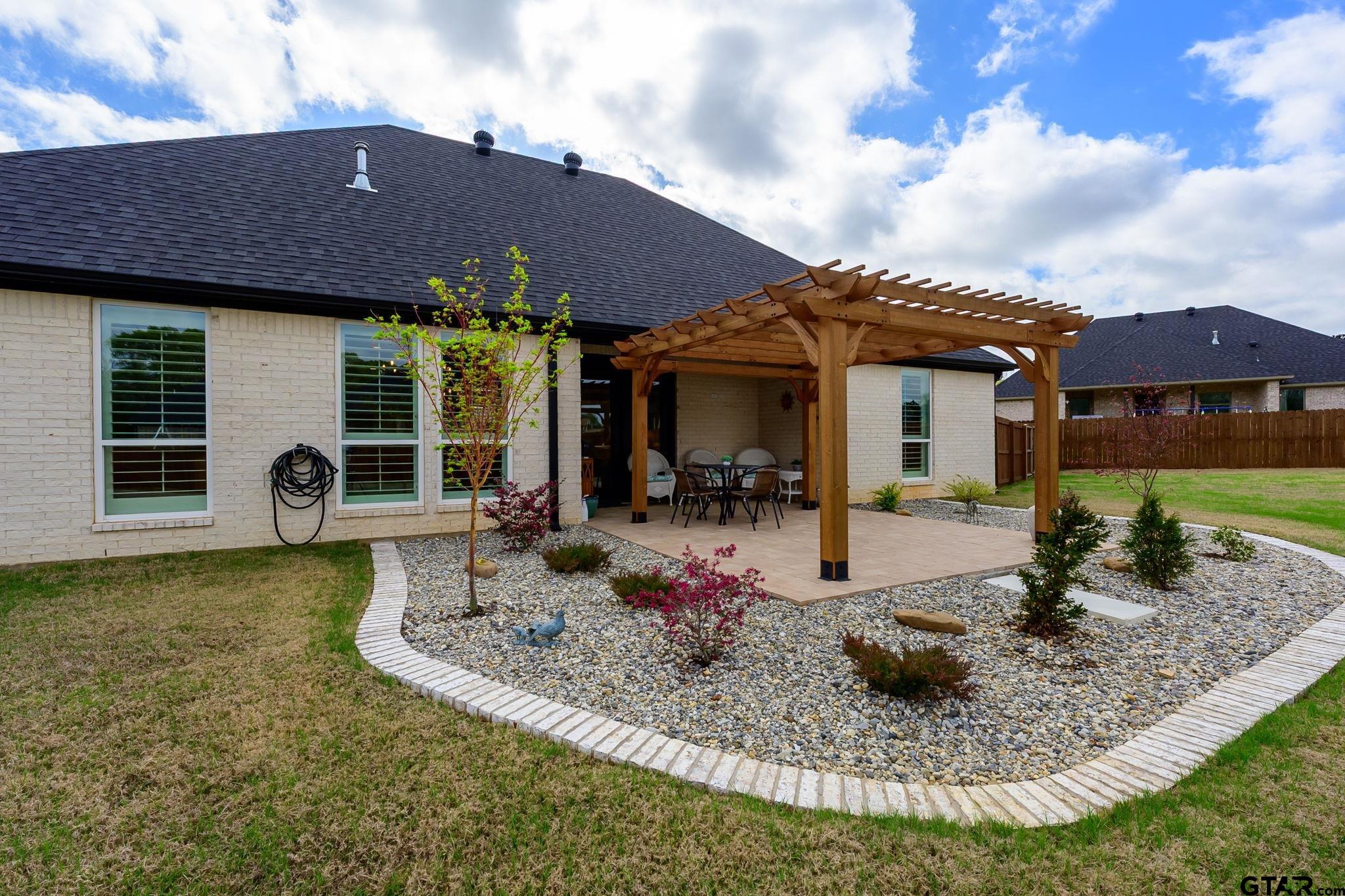 11858 Gillian Court Tyler, TX 75703 - Photo 20 of 24 a view of a house with backyard and sitting area