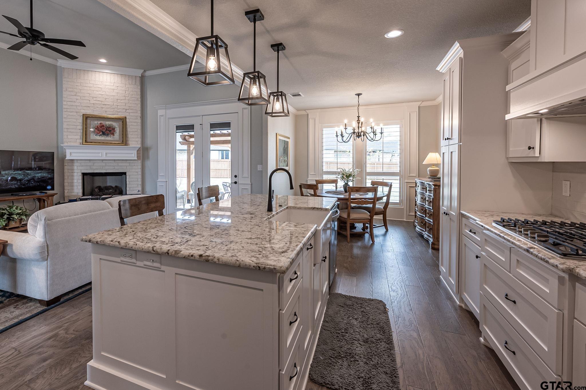 11858 Gillian Court Tyler, TX 75703 - Photo 4 of 24 a kitchen with sink stove and cabinets