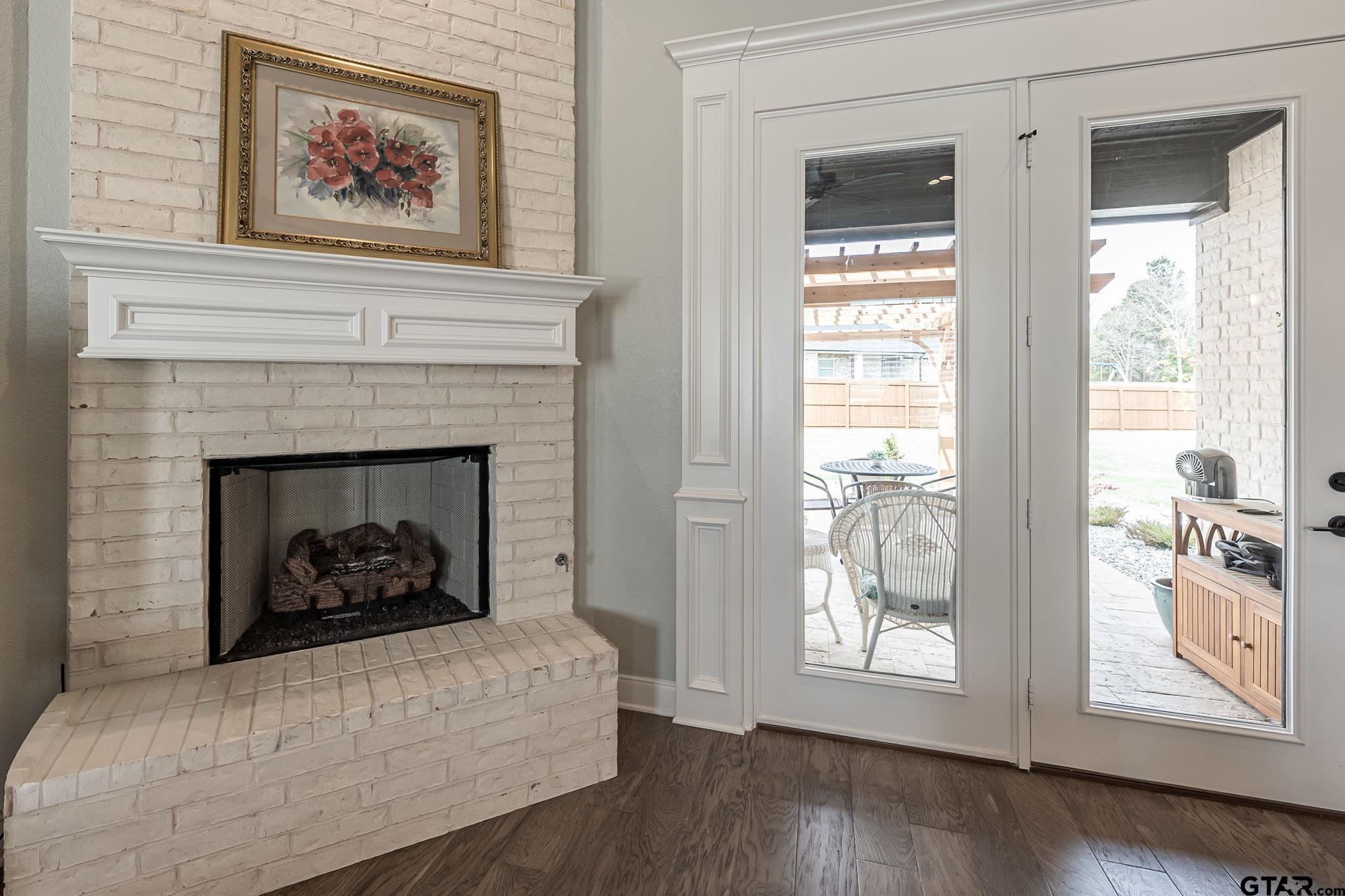 11858 Gillian Court Tyler, TX 75703 - Photo 8 of 24 a living room with furniture and a fireplace