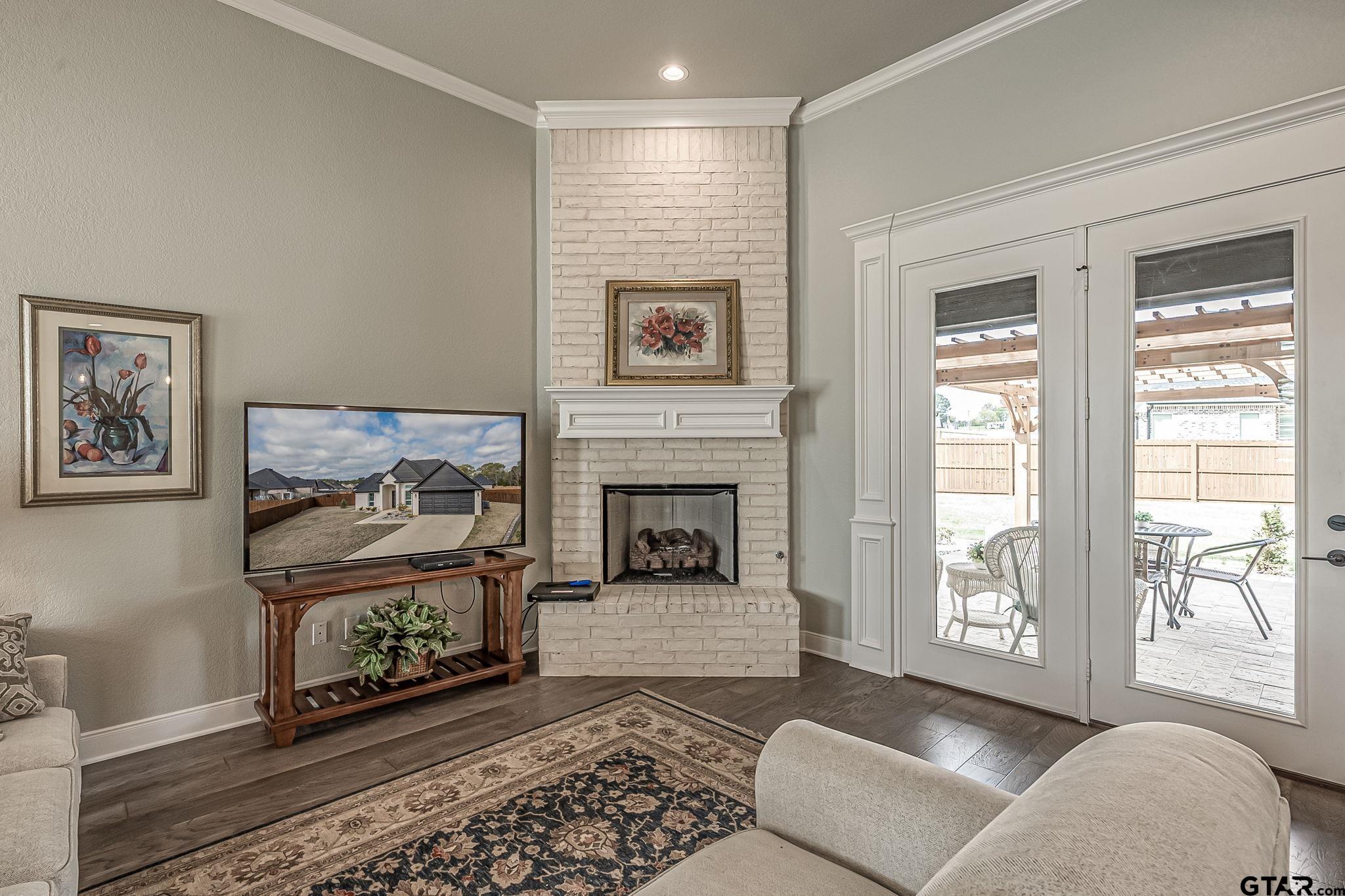 11858 Gillian Court Tyler, TX 75703 - Photo 9 of 24 a living room with furniture and a fireplace