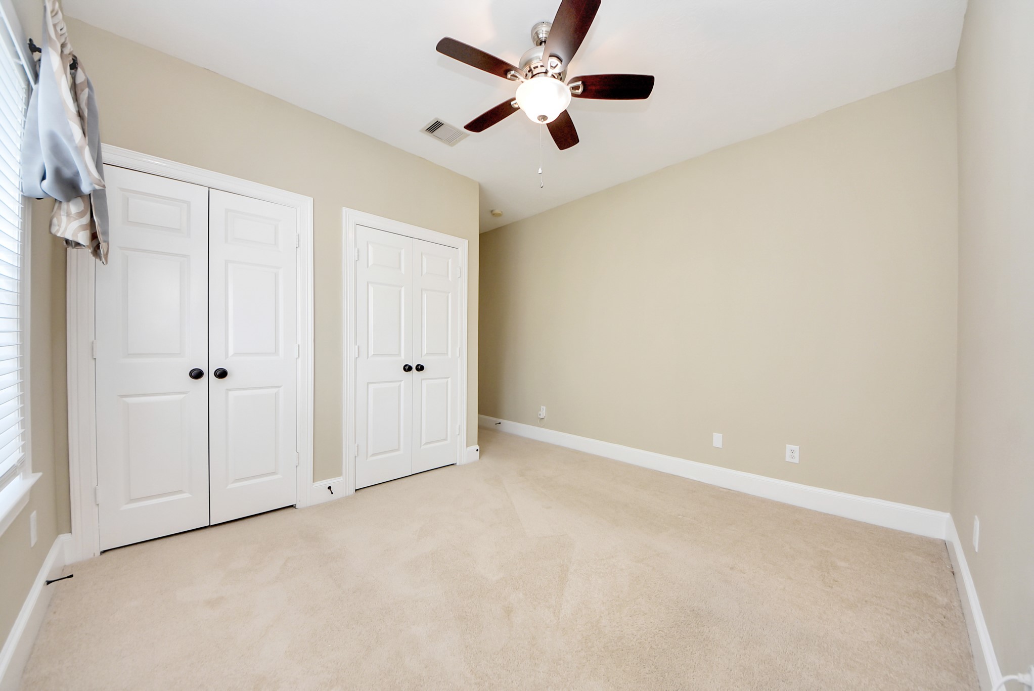 2119 Stuart Street Houston, TX 77004 - Photo 29 of 37 This bedroom also offers dual closets with built-in shelving!