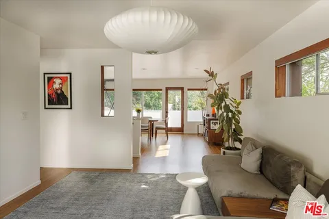 a view of a living room and dining room