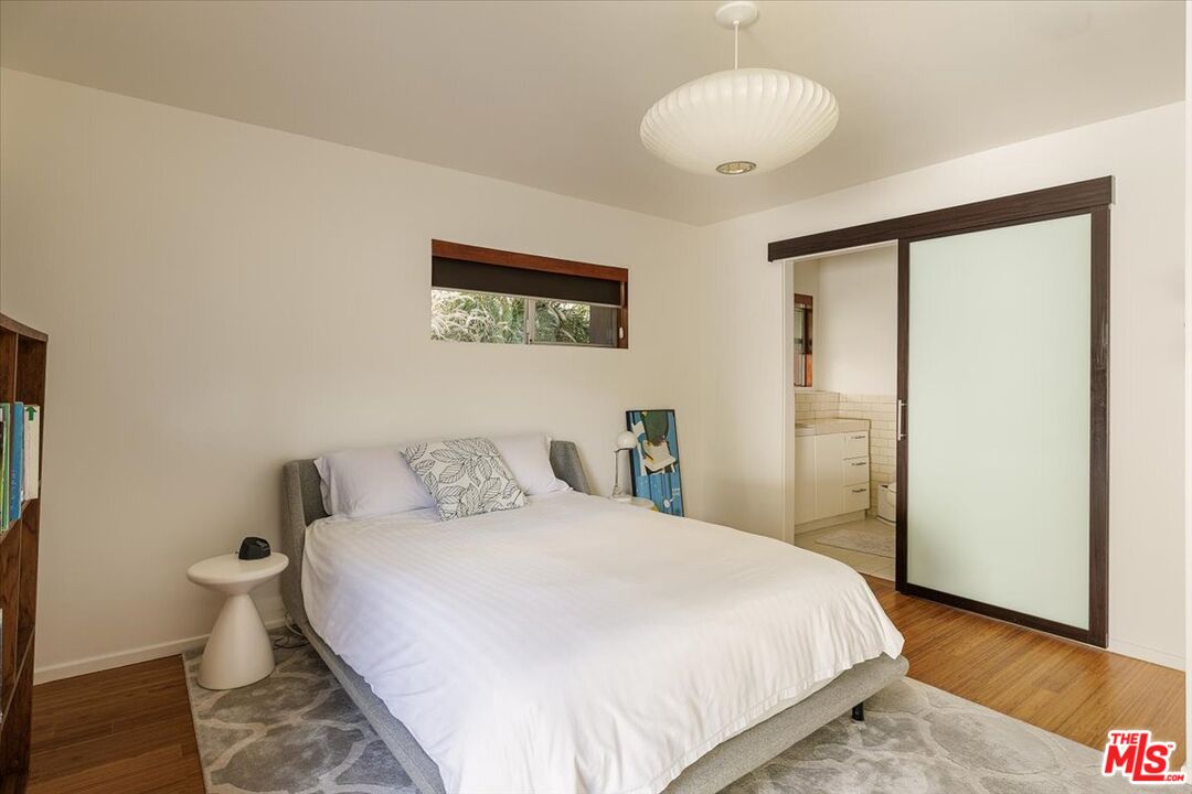 3733 Rolle Street Los Angeles, CA 90031 - Photo 19 of 36 a bedroom with a bed and a chandelier