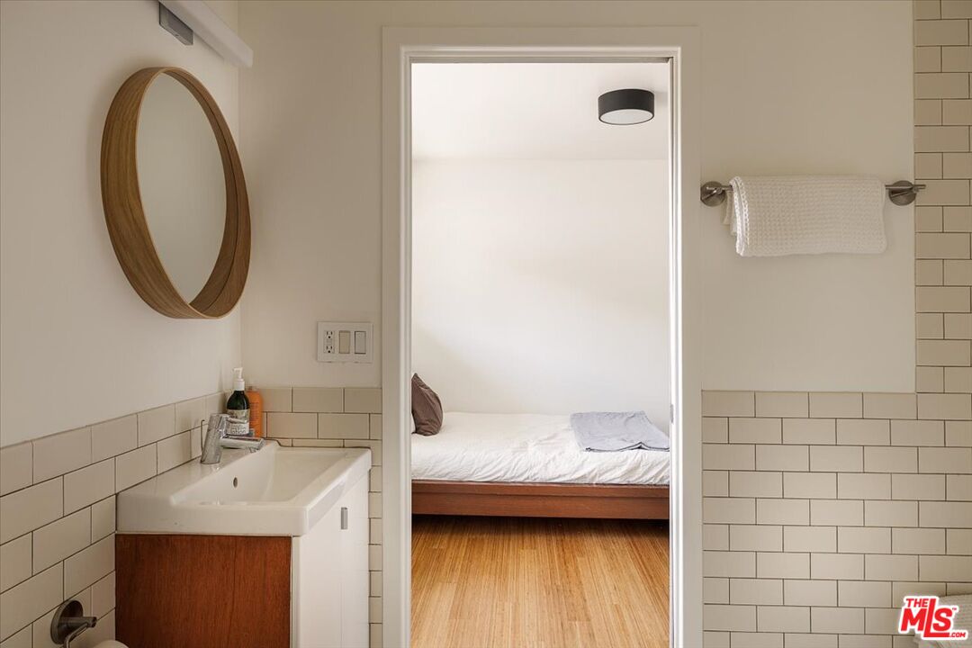 3733 Rolle Street Los Angeles, CA 90031 - Photo 26 of 36 a en suite bathroom with a sink a mirror and a shower