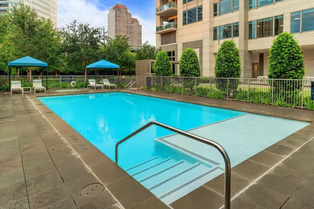 a view of a swimming pool with a lounge chairs