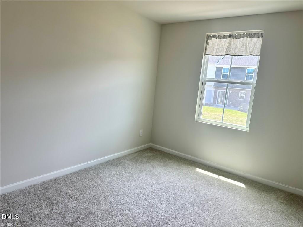 6840 Tarik Lane Raleigh, NC 27610 - Photo 17 of 27 an empty room with a window