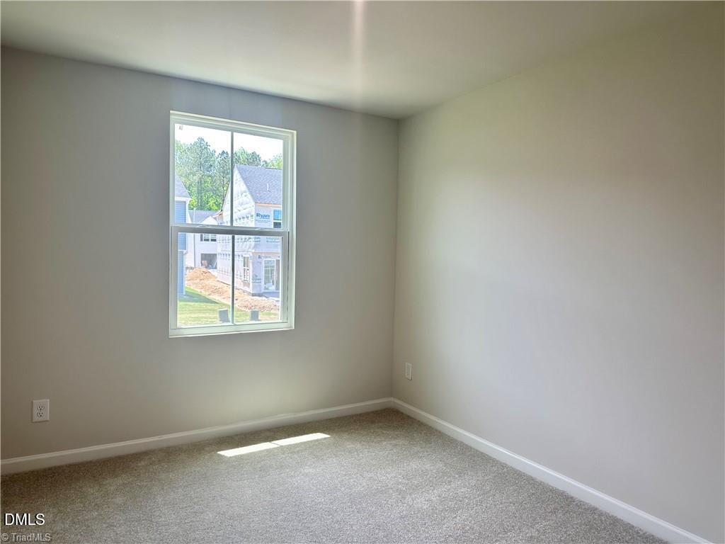 6840 Tarik Lane Raleigh, NC 27610 - Photo 19 of 27 an empty room with a window