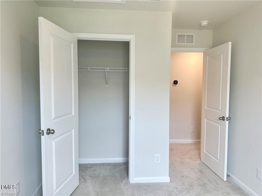 6840 Tarik Lane Raleigh, NC 27610 - Photo 20 of 27 a view of a hallway with closet