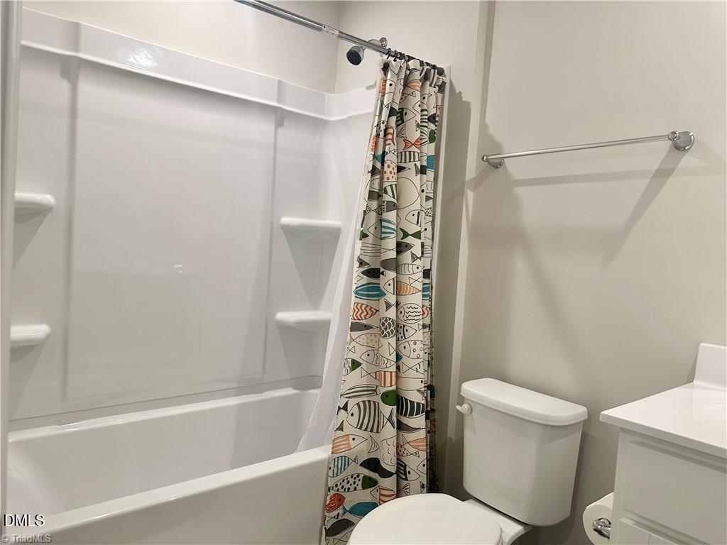 6840 Tarik Lane Raleigh, NC 27610 - Photo 21 of 27 a white toilet sitting next to a bath tub