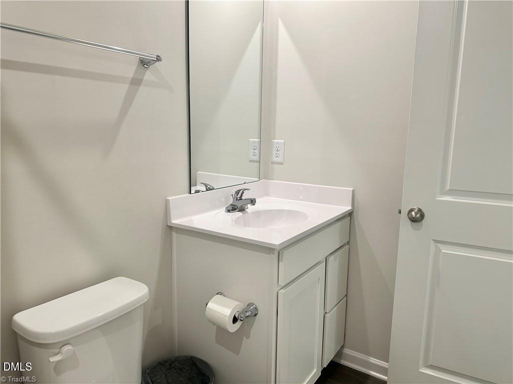6840 Tarik Lane Raleigh, NC 27610 - Photo 22 of 27 a bathroom with a sink a toilet and shower