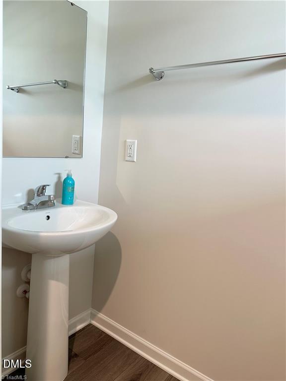 6840 Tarik Lane Raleigh, NC 27610 - Photo 9 of 27 a bathroom with a sink and a mirror