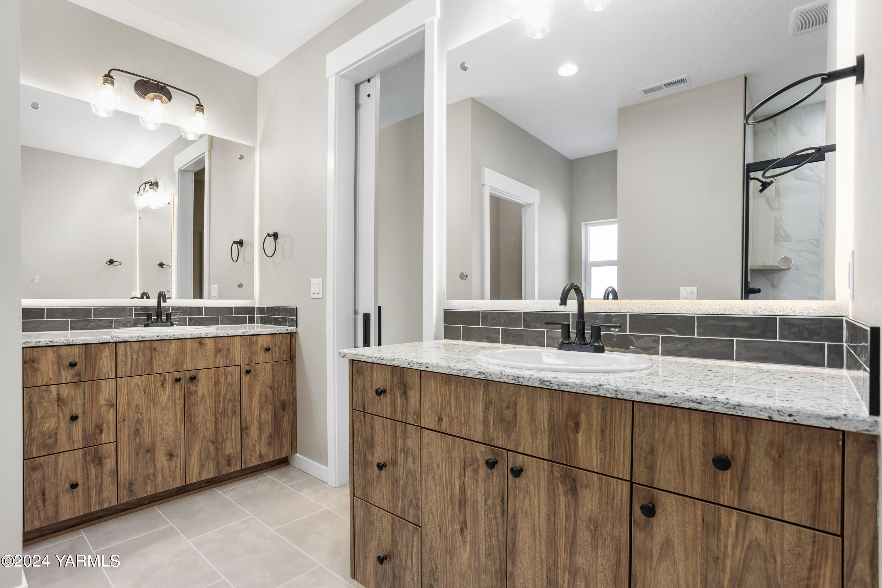 116 Scott Road Prosser, WA 99350 - Photo 25 of 38 a bathroom with a granite countertop sink double and mirror