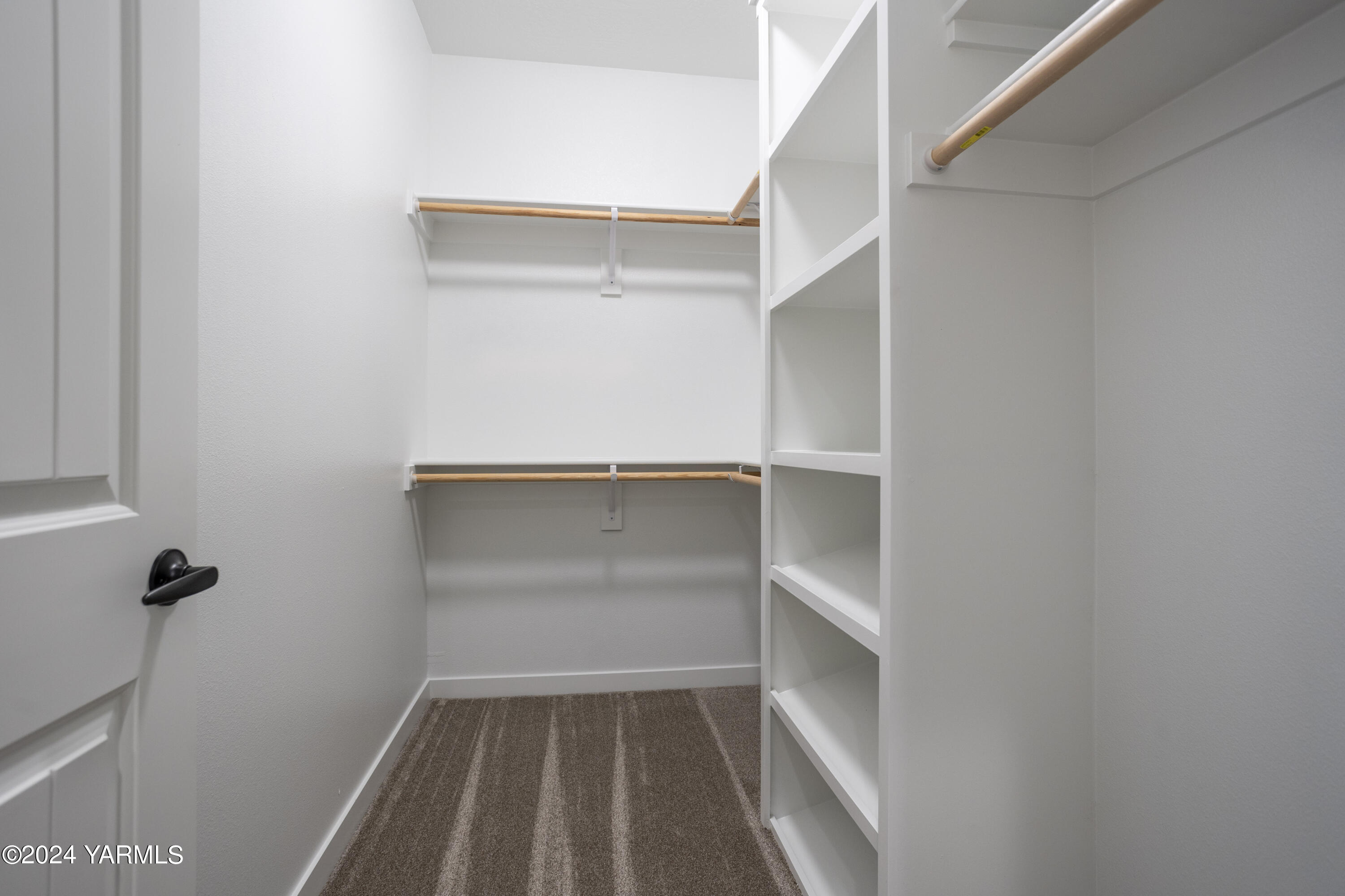 116 Scott Road Prosser, WA 99350 - Photo 30 of 38 a view of walk in closet with empty racks
