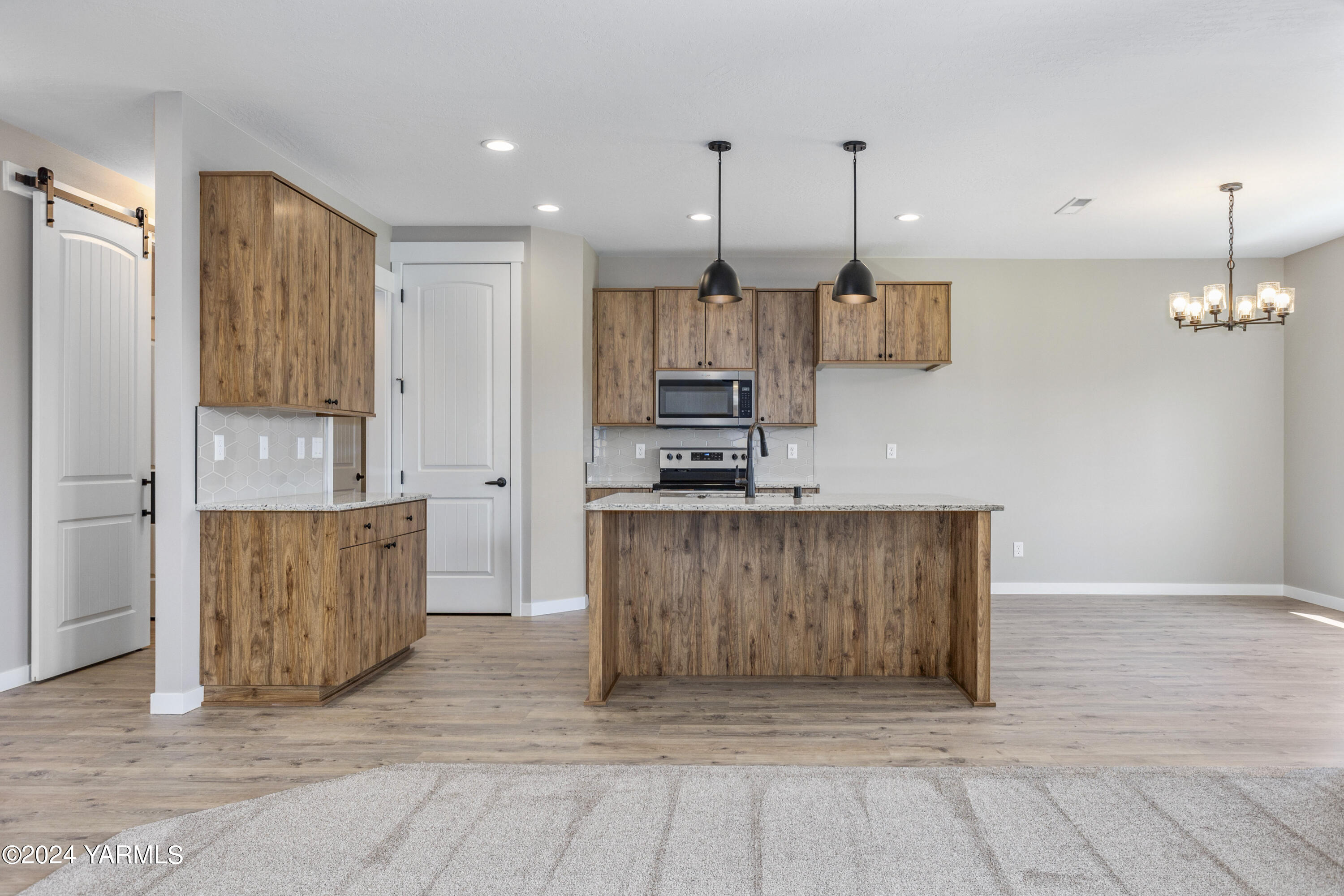 116 Scott Road Prosser, WA 99350 - Photo 4 of 38 a view of kitchen with stainless steel appliances granite countertop cabinets and wooden floor