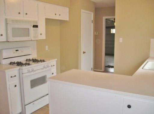 9807 Mountain Quail Road Austin, TX 78758 - Photo 6 of 19 a kitchen with cabinets appliances and a sink