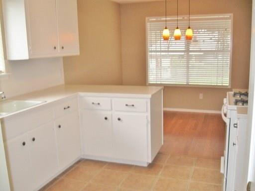 9807 Mountain Quail Road Austin, TX 78758 - Photo 8 of 19 a view of cabinets and window
