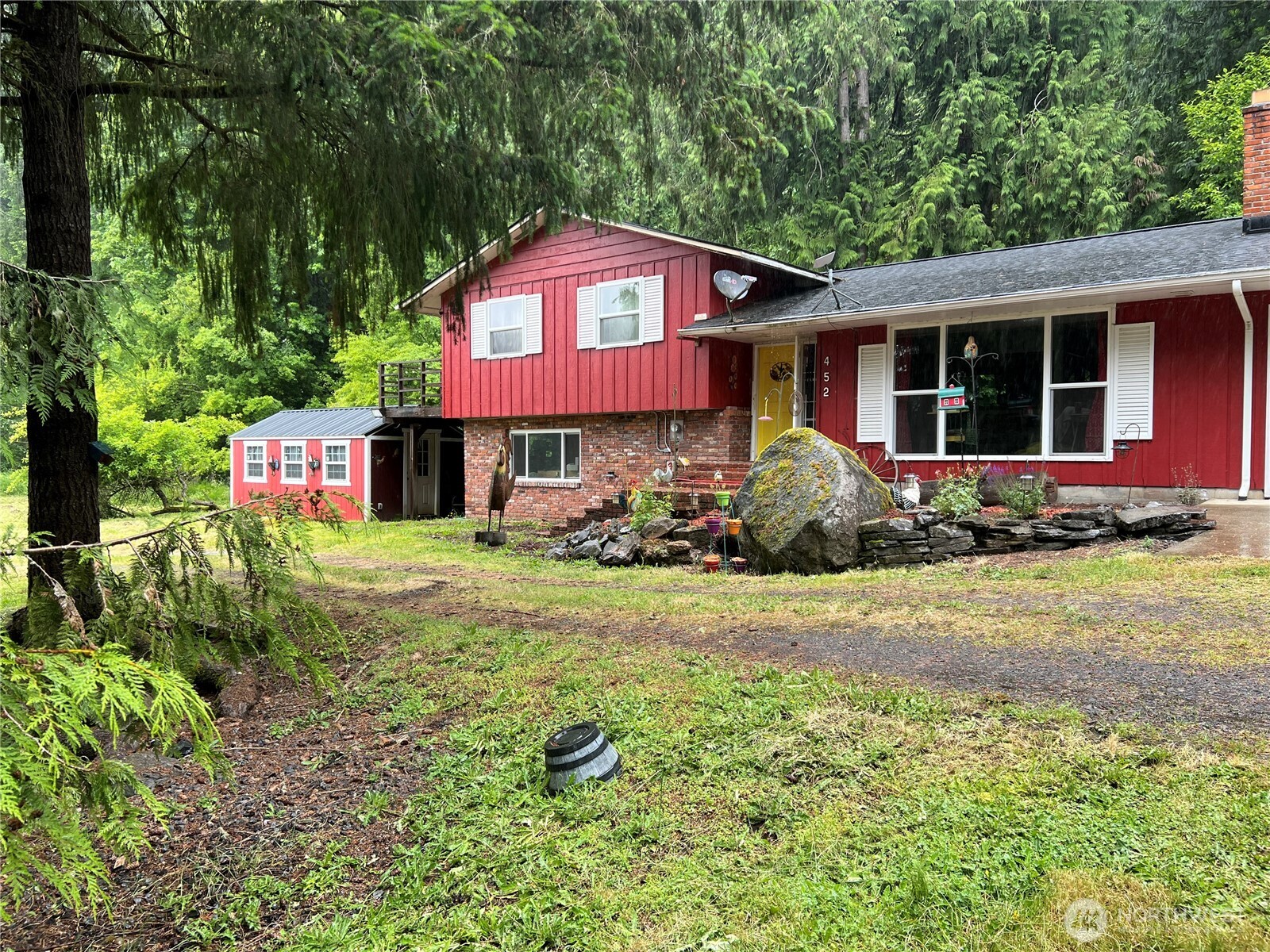 452 Lincoln Creek Road Centralia, WA 98531 - Photo 1 of 25 a front view of house with yard and trees in the background