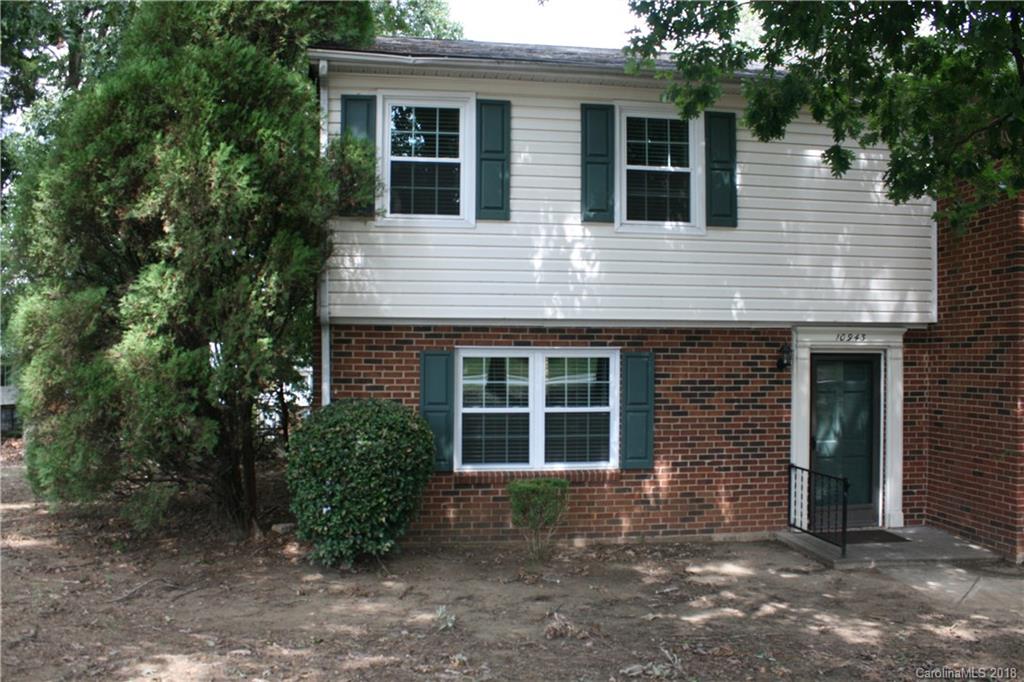 10943 Park Road Charlotte, NC 28226 - Photo 1 of 31 a view of front a house with plants and large tree