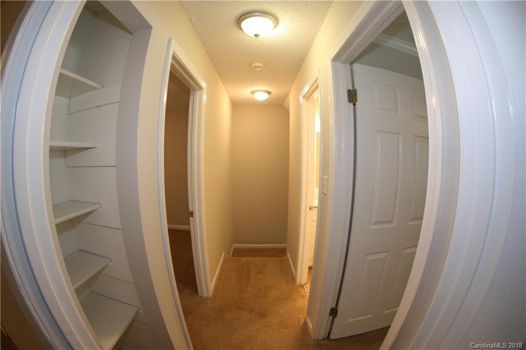 10943 Park Road Charlotte, NC 28226 - Photo 11 of 31 a view of a bathroom from a hallway