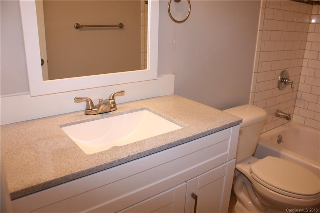 10943 Park Road Charlotte, NC 28226 - Photo 13 of 31 a bathroom with a sink and a toilet