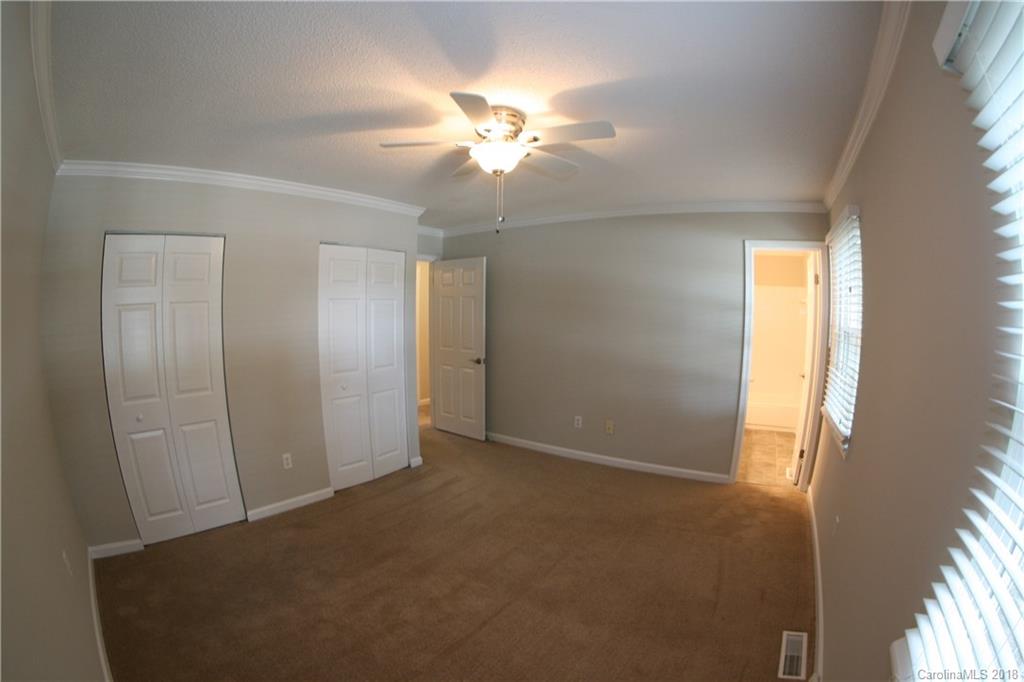 10943 Park Road Charlotte, NC 28226 - Photo 15 of 31 a view of a livingroom with a ceiling fan and window