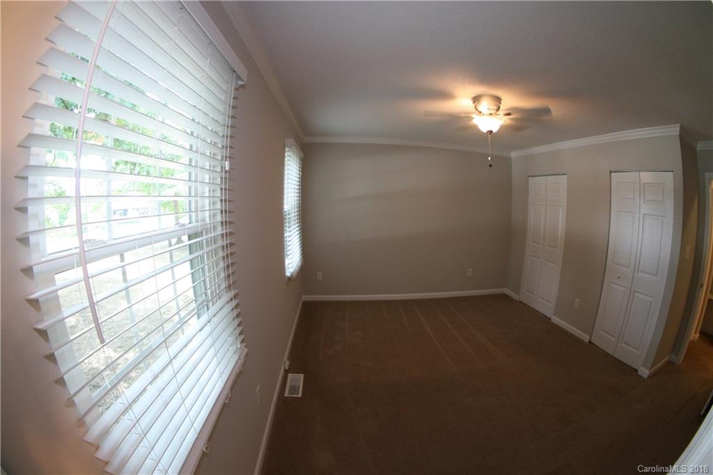 10943 Park Road Charlotte, NC 28226 - Photo 16 of 31 a view of empty room with windows