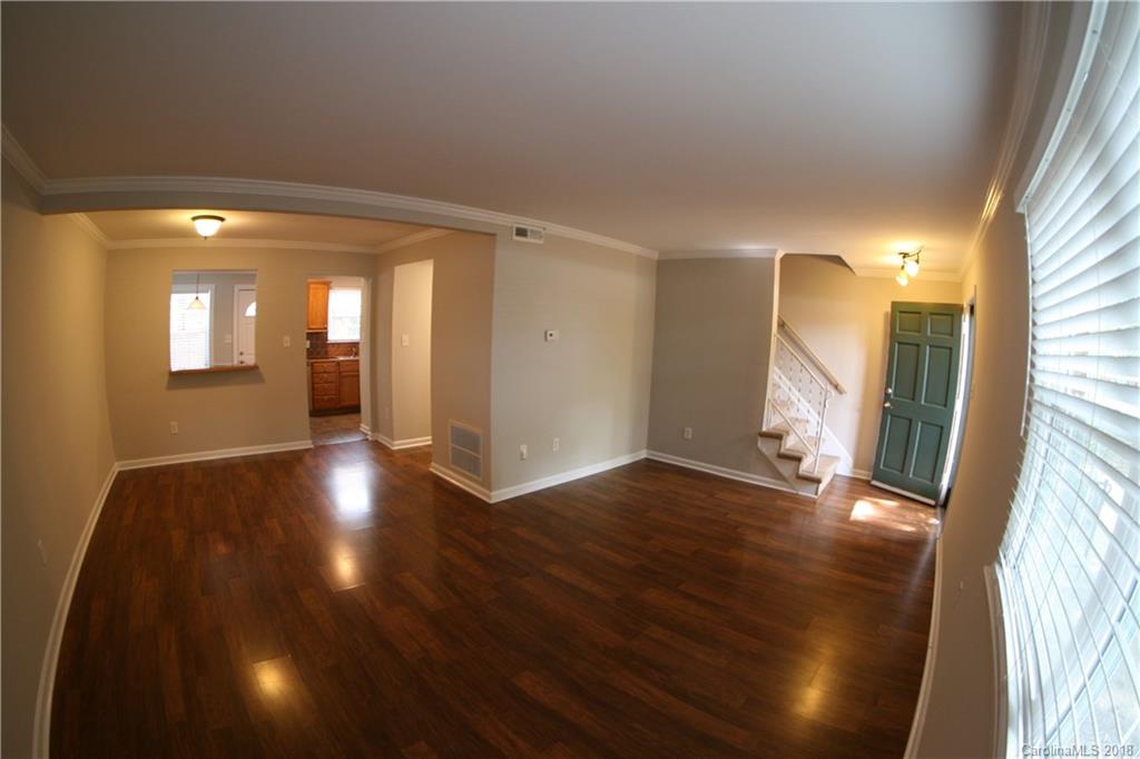 10943 Park Road Charlotte, NC 28226 - Photo 3 of 31 a view of a livingroom with wooden floor and a window