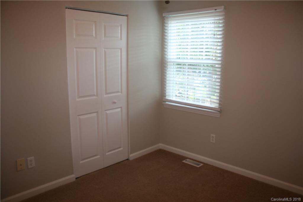 10943 Park Road Charlotte, NC 28226 - Photo 22 of 31 an empty room with a window