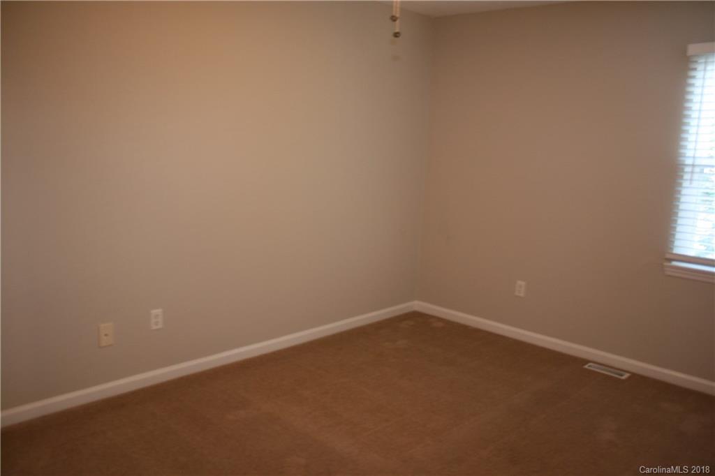 10943 Park Road Charlotte, NC 28226 - Photo 25 of 31 an empty room with a window
