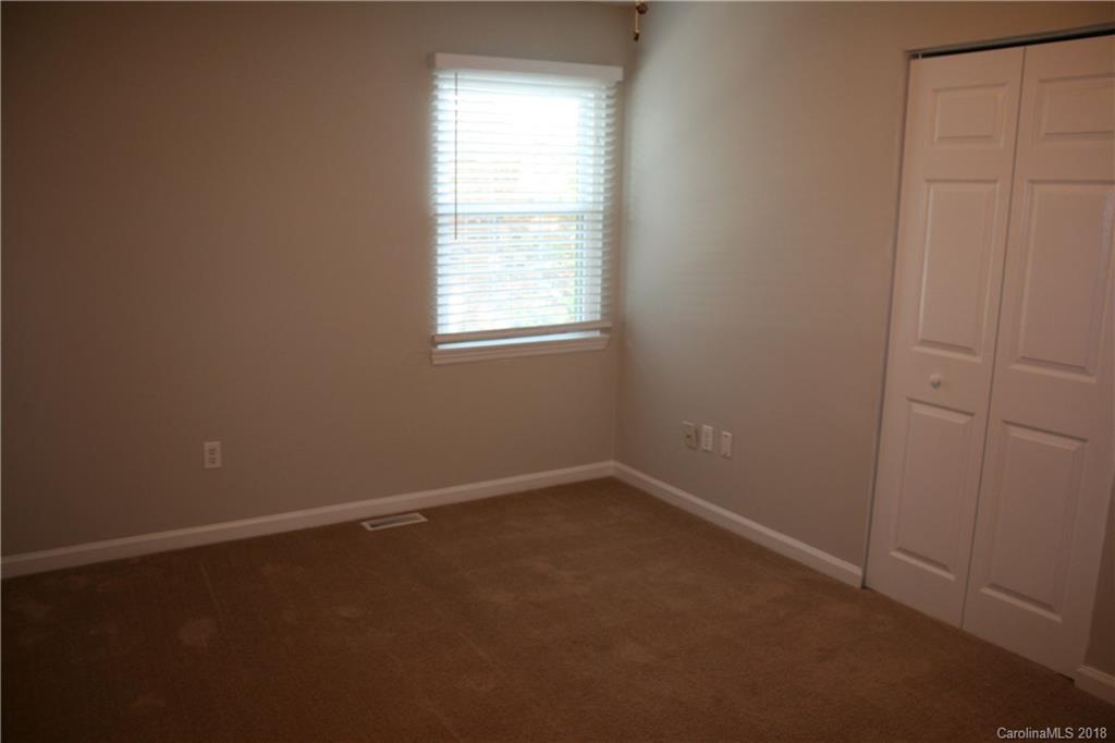 10943 Park Road Charlotte, NC 28226 - Photo 26 of 31 an empty room with a window