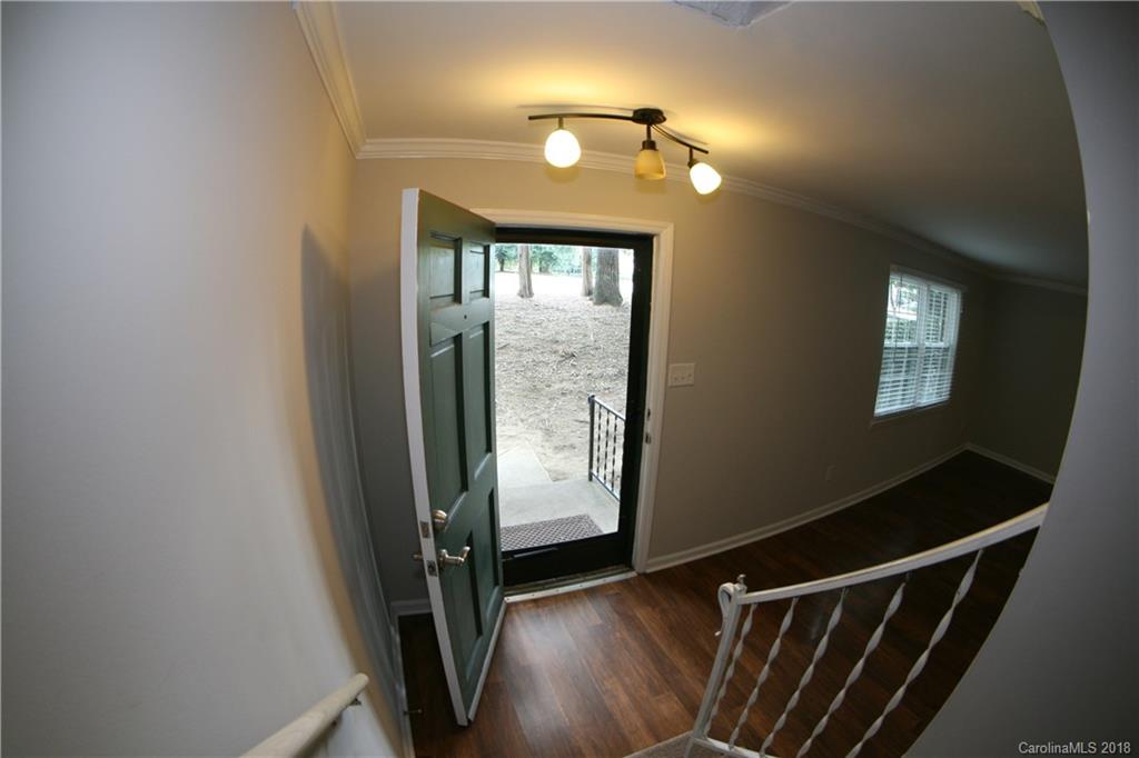 10943 Park Road Charlotte, NC 28226 - Photo 27 of 31 a view of an entryway with wooden floor