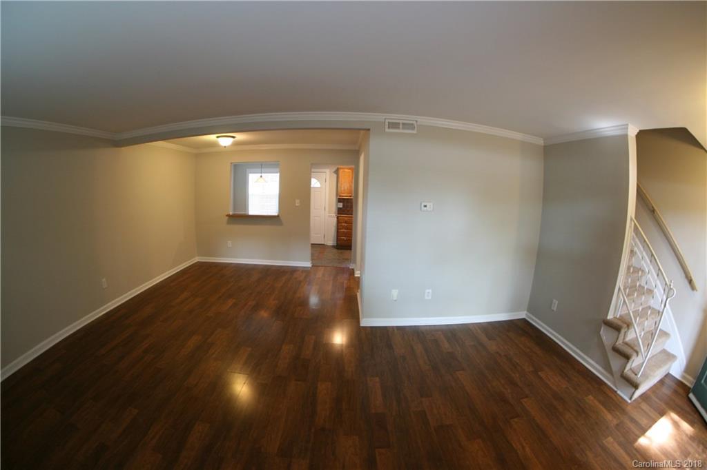 10943 Park Road Charlotte, NC 28226 - Photo 4 of 31 a view of livingroom with hardwood floor and window