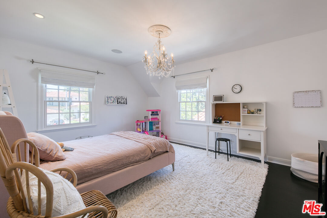 10736 Le Conte Avenue Los Angeles, CA 90024 - Photo 30 of 44 a bedroom with a bed and a flat screen tv