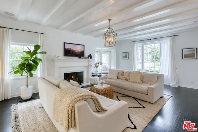 a view of a dining room and a table chairs