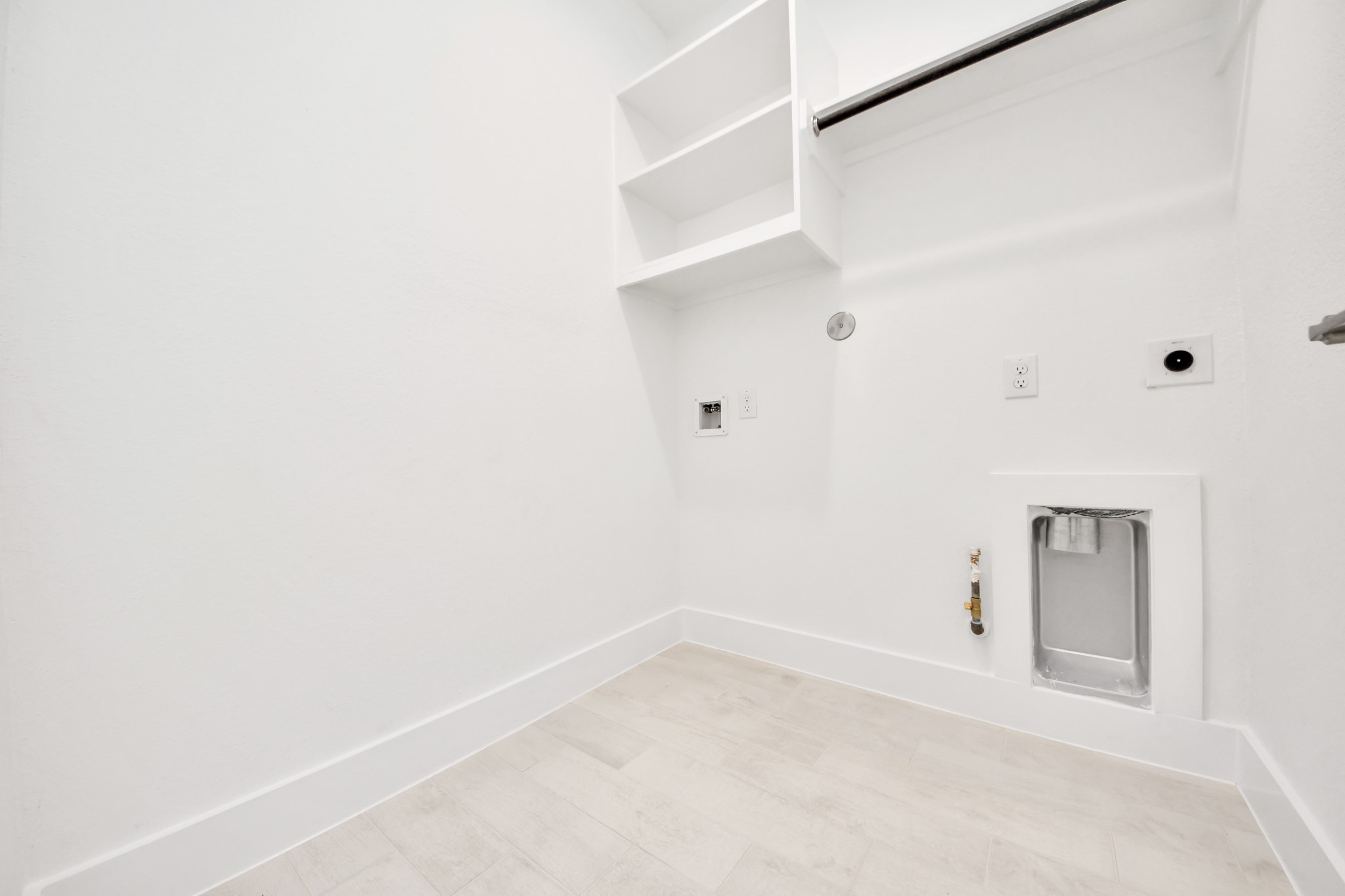 3038 Native Spg Drive Spring, TX 77373 - Photo 40 of 44 A perfect blend of functionality and comfort. Capture the essence of easy living with a first-floor laundry room, thoughtfully equipped with shelving for effortless organization. Both electric and gas connections available.