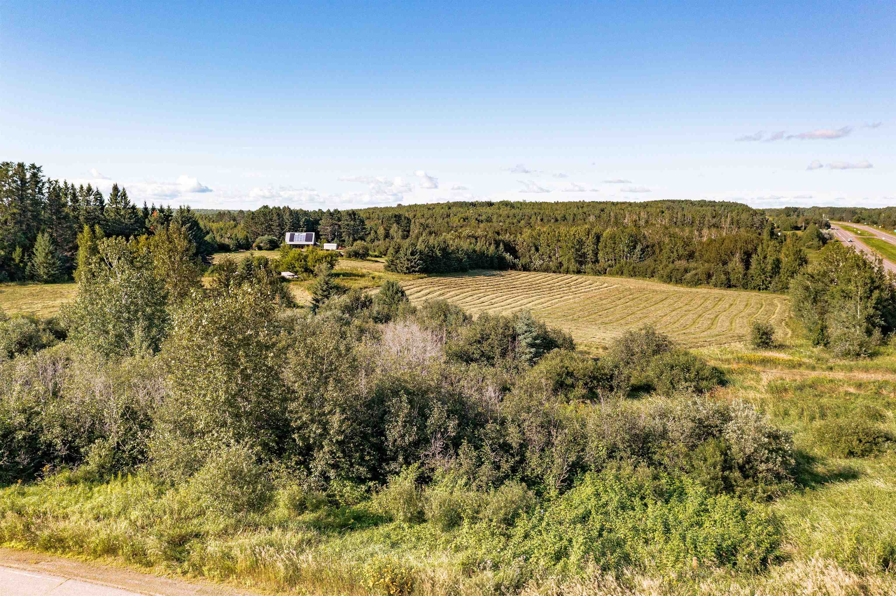 Xxx Nelson Road Cloquet, MN 55720 - Photo 5 of 6 Aerial view of sparsely populated area with large plots for crops and a forest
