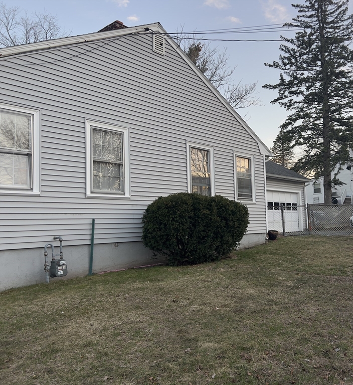 76 Allston Street Lawrence, MA 01841 - Photo 1 of 6 a view of a house with a yard