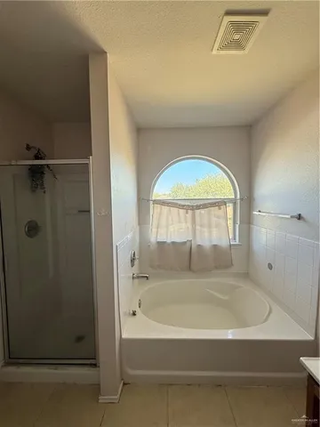 a view of a bathroom from a hallway