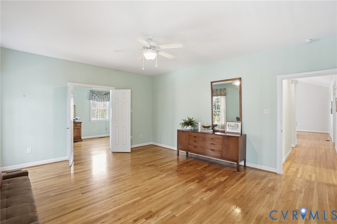 14430 Overlook Ridge Lane Beaverdam, VA 23015 - Photo 28 of 71 a view of an empty room and kitchen with wooden floor