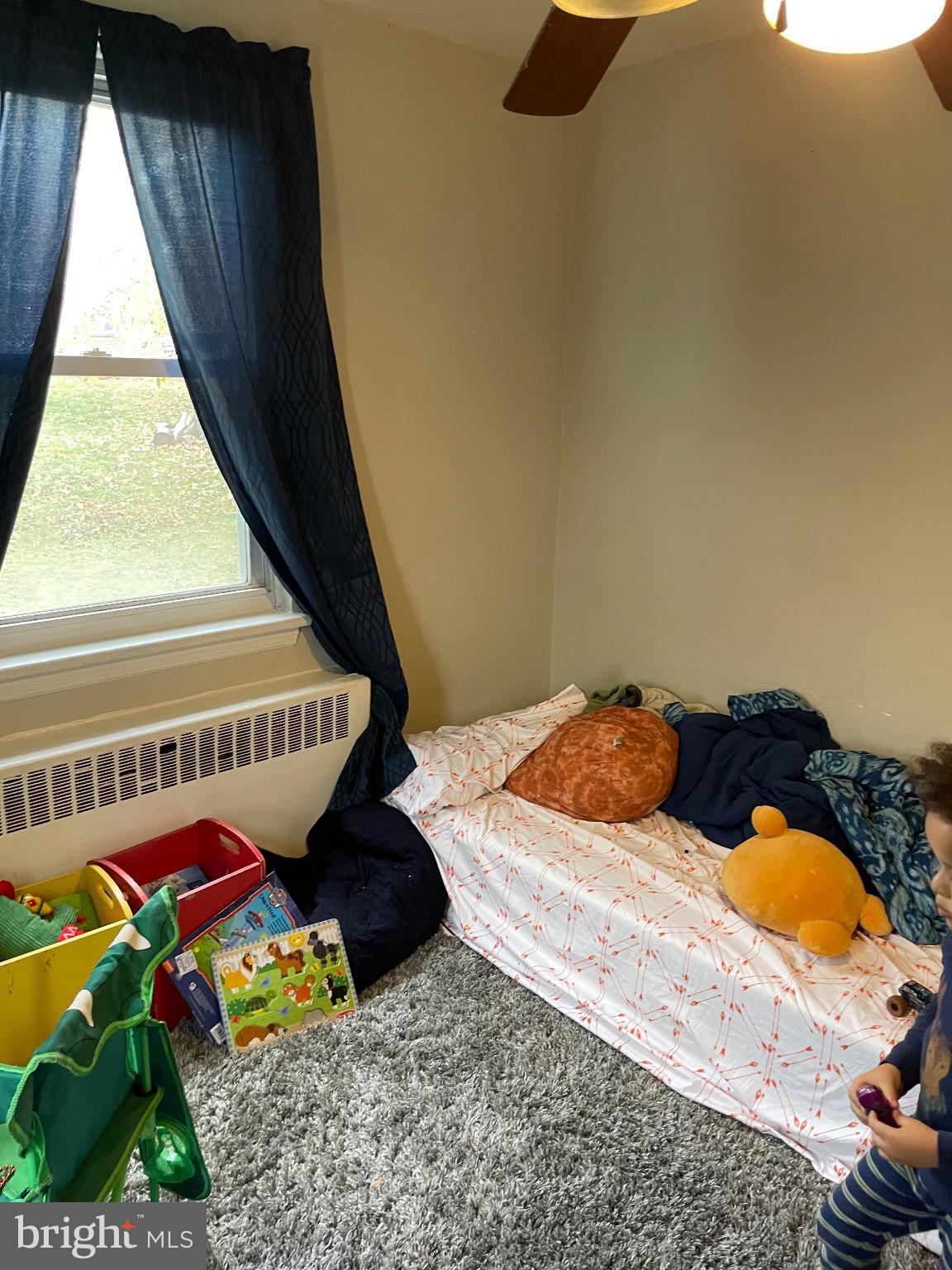213 Gray Street Chester, PA 19013 - Photo 13 of 38 a bedroom with bed and a window