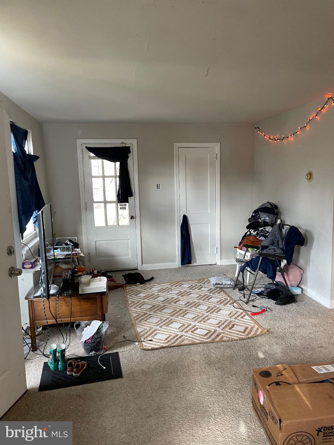 213 Gray Street Chester, PA 19013 - Photo 19 of 38 a living room with furniture a window and a flat screen tv